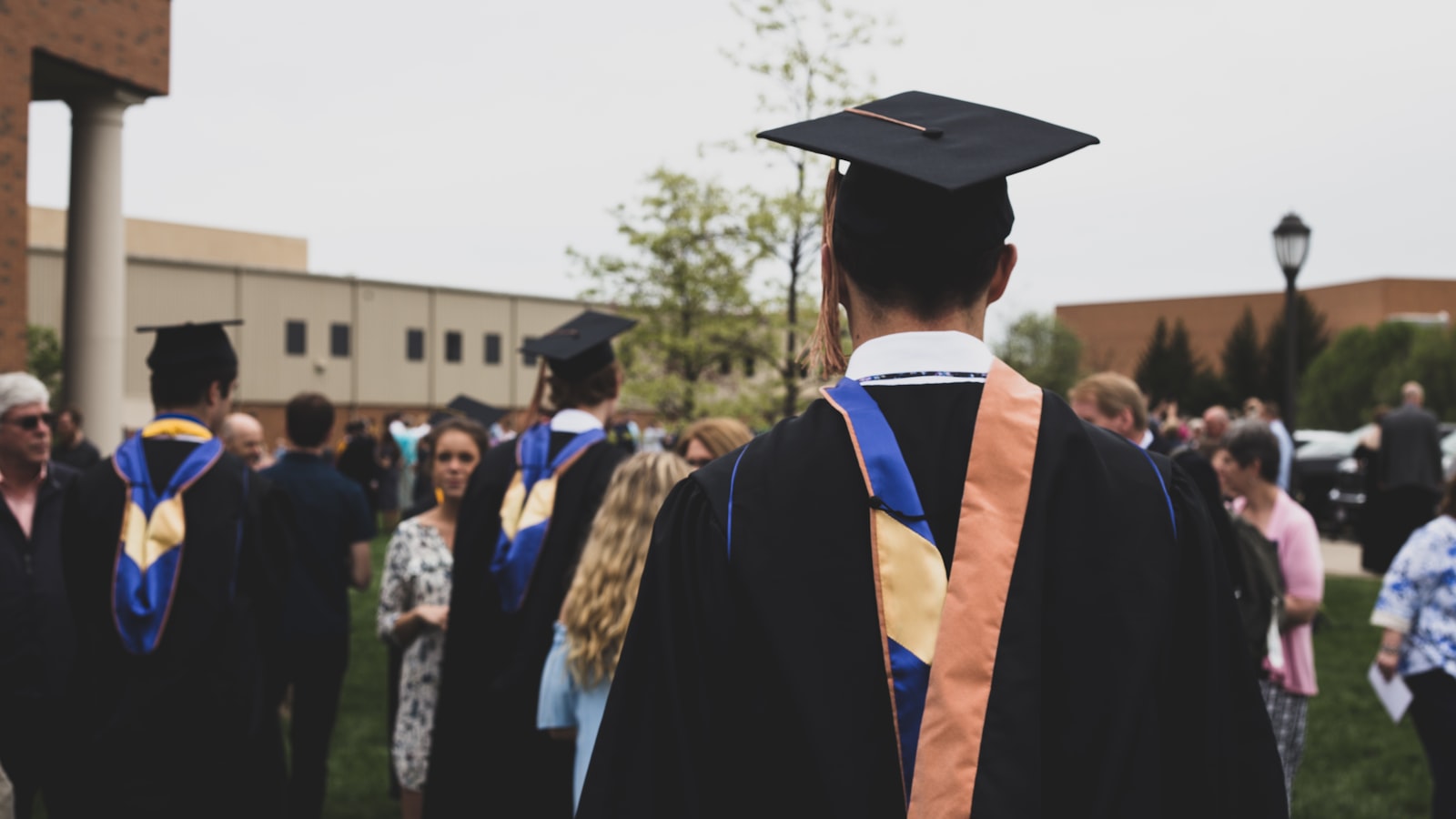 Graduate holding a certificate at a ceremony