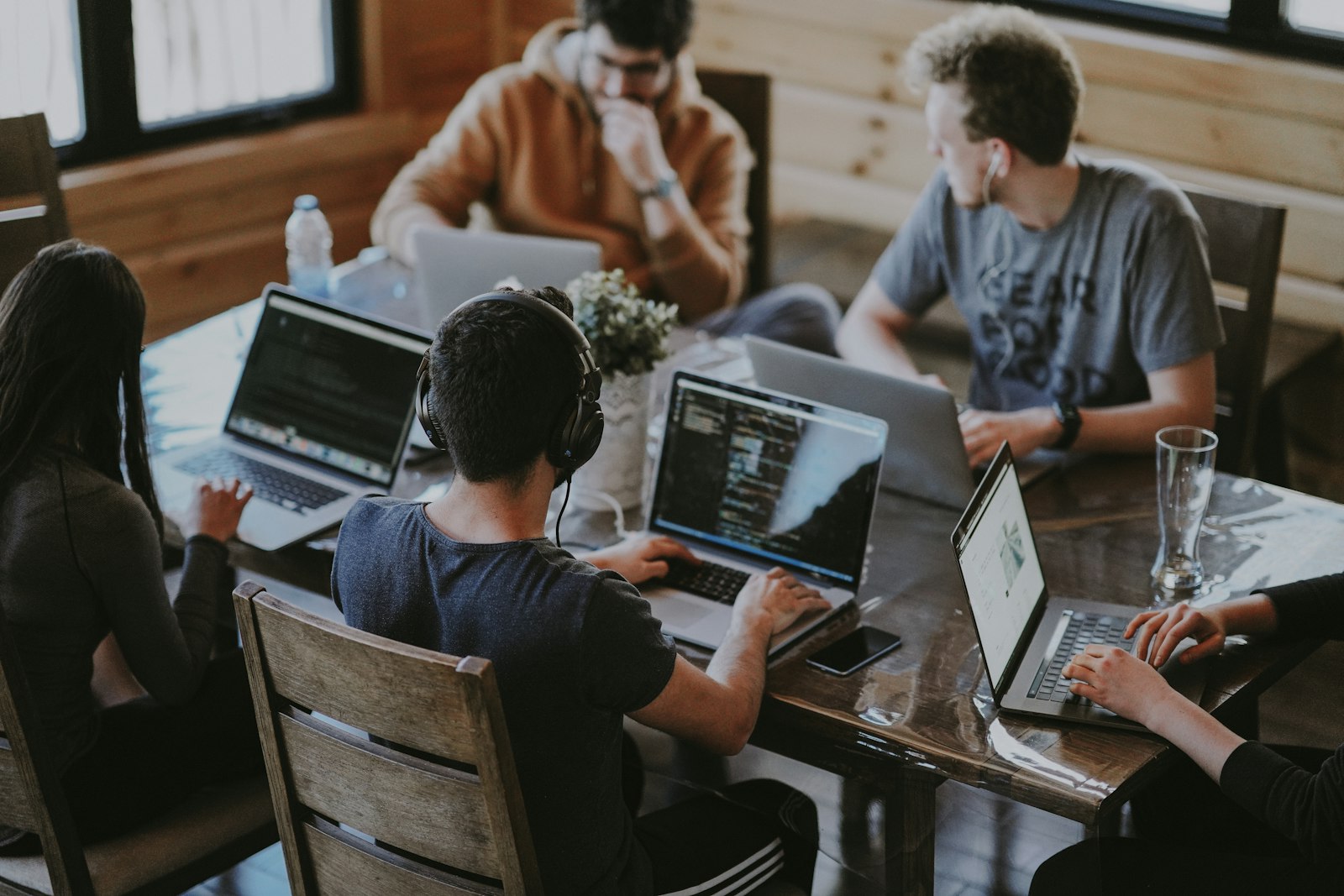 Modern team workspace with desks and laptops